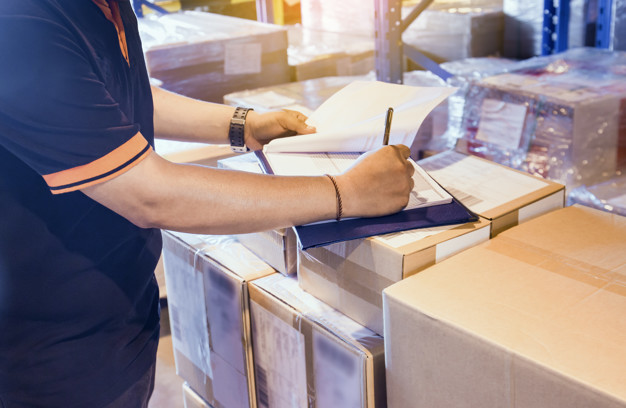 Warehouse worker are working in warehouse store with inventory the shipment. Premium Photo